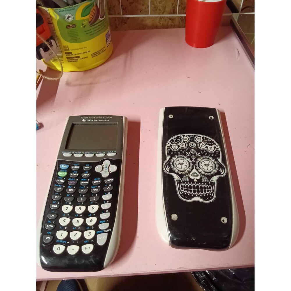 Texas Instruments TI-84 Plus Silver Edition Graphing Calculator with Skull Cover